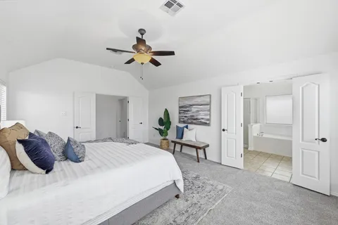 a bedroom with a bed and a table