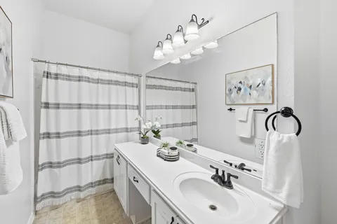 a bathroom with a double vanity sink mirror and double