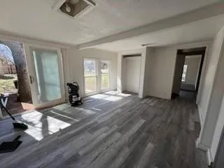 a view of livingroom with furniture and a window