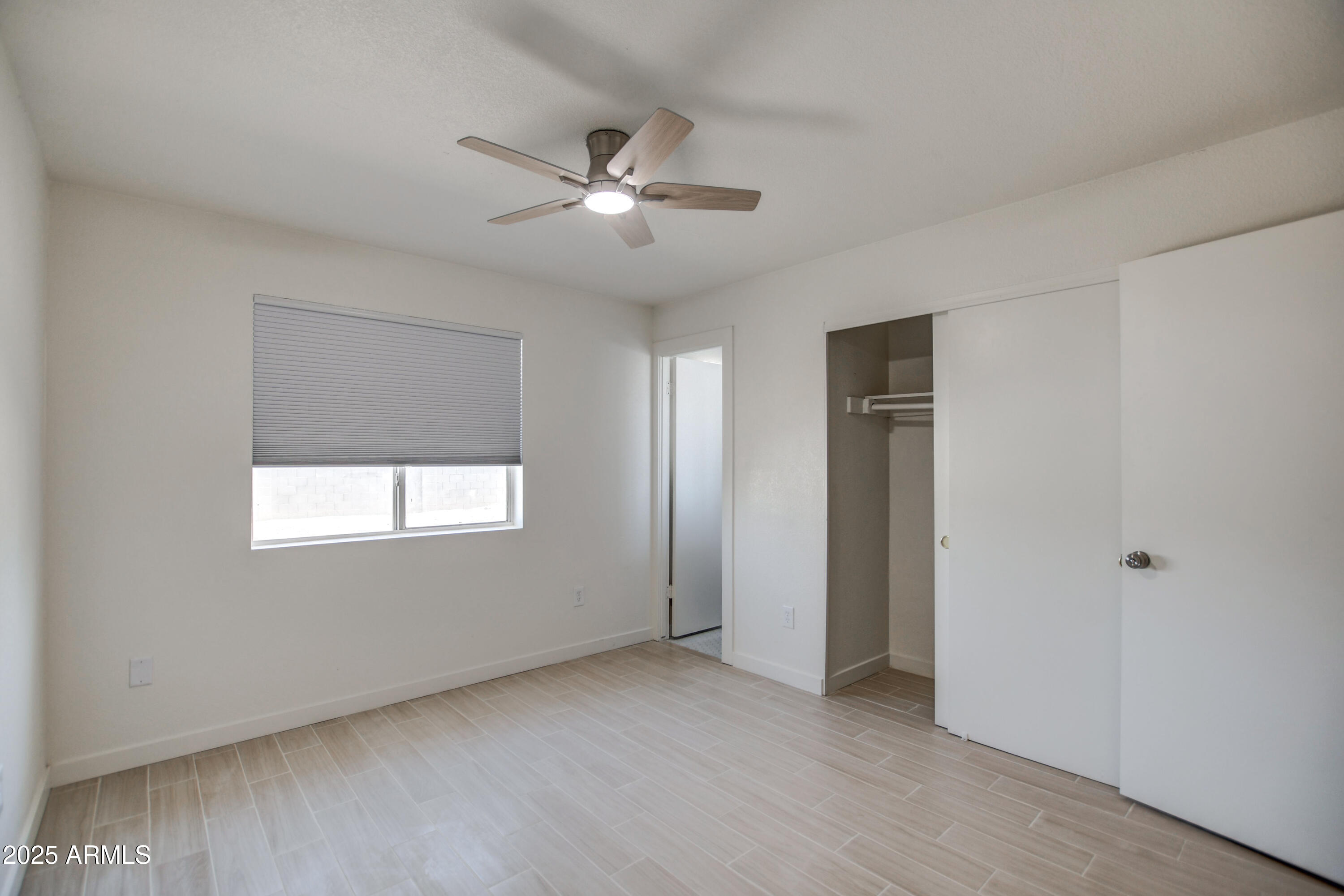 4870 West Almeria Road Phoenix, AZ 85035 - Photo 11 of 22 a view of an empty room with a window
