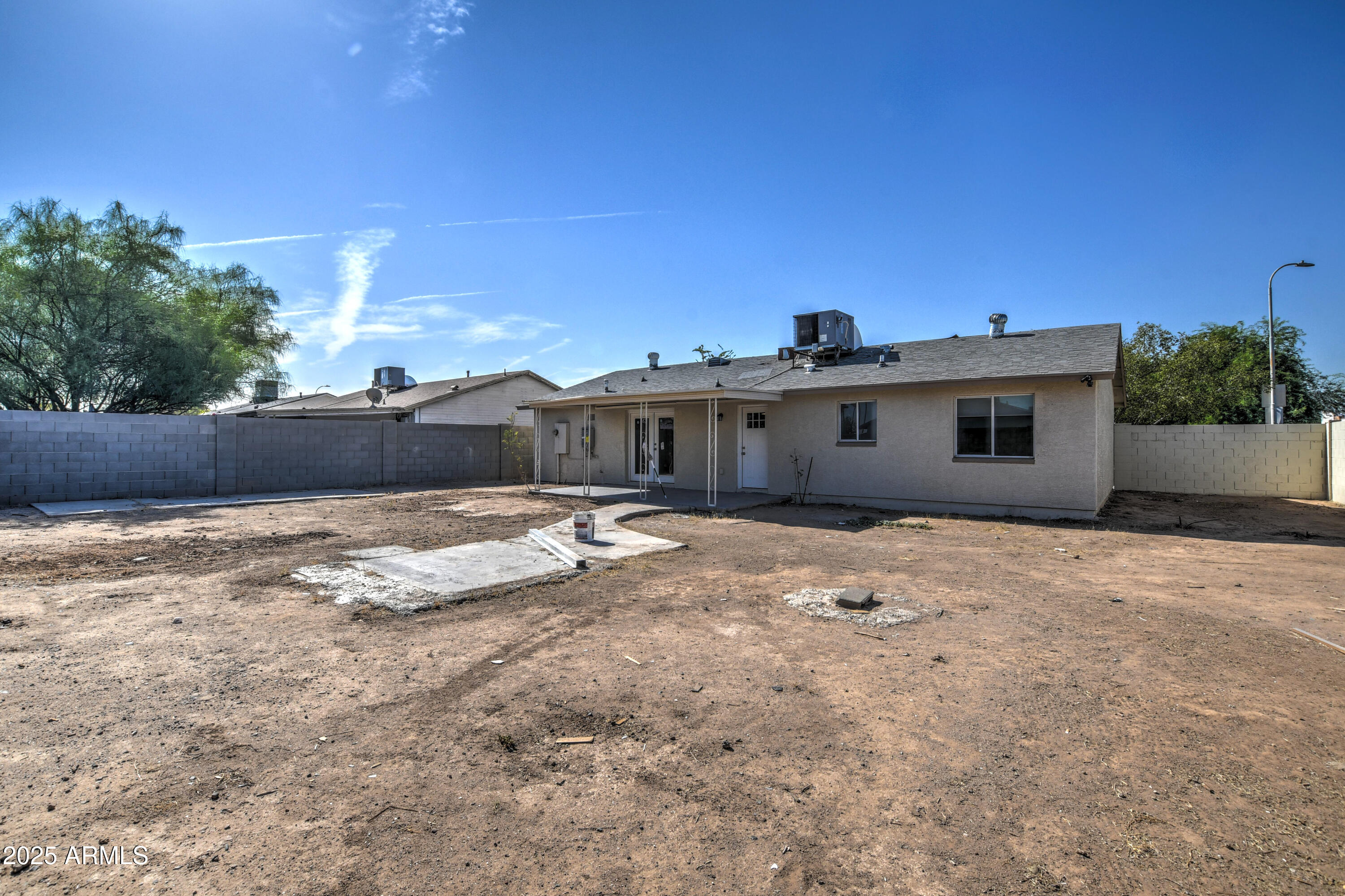 4870 West Almeria Road Phoenix, AZ 85035 - Photo 21 of 22 a front view of a house with a yard