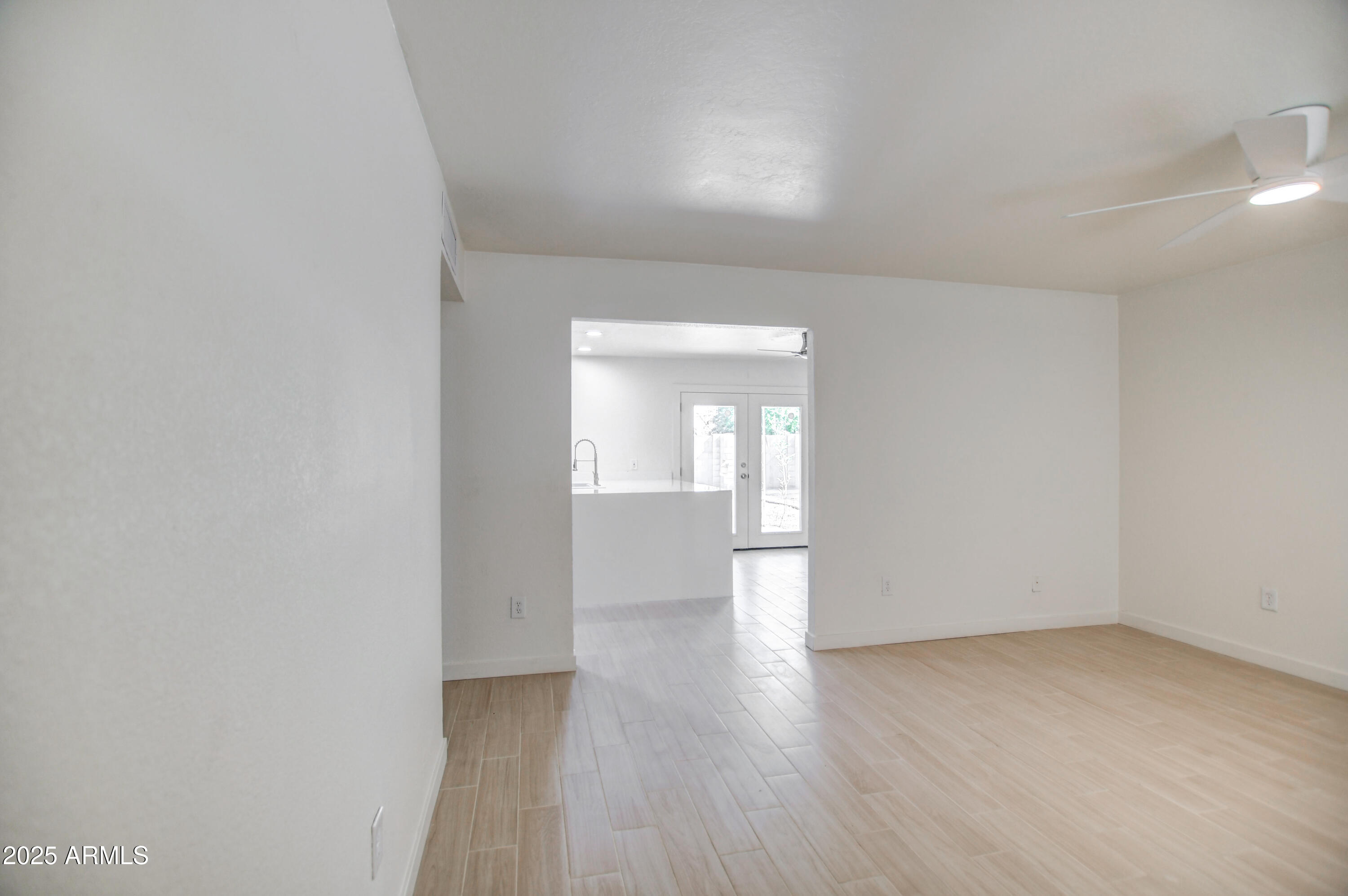 4870 West Almeria Road Phoenix, AZ 85035 - Photo 3 of 22 a view of empty room with wooden floor