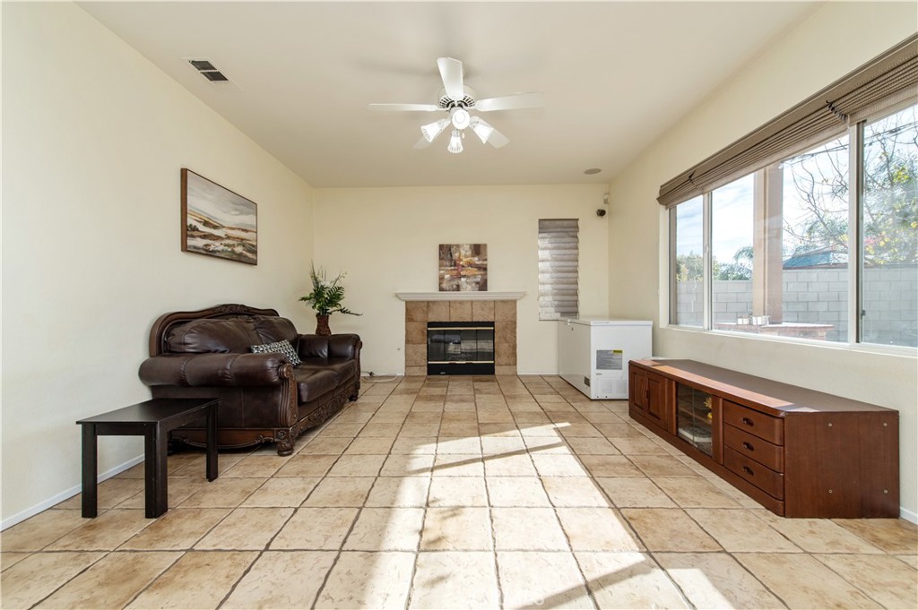 9111 Hamilton Street Rancho Cucamonga, CA 91701 - Photo 11 of 46 a living room with furniture and a fireplace
