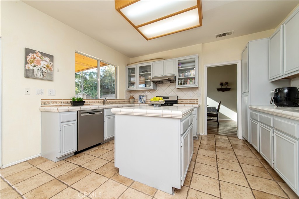9111 Hamilton Street Rancho Cucamonga, CA 91701 - Photo 14 of 46 a kitchen with sink cabinets and window