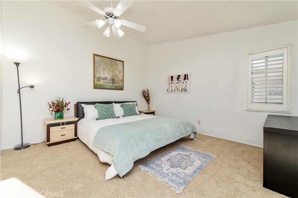 9111 Hamilton Street Rancho Cucamonga, CA 91701 - Photo 27 of 46 a spacious bedroom with a bed and a cabinets