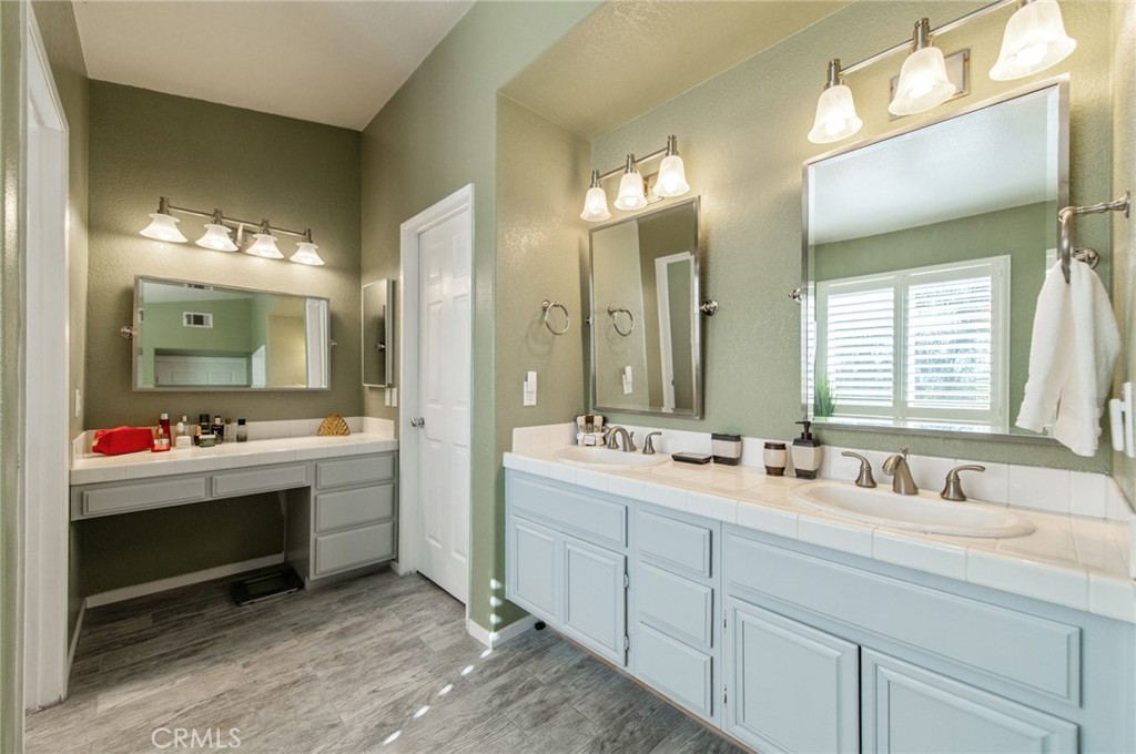 9111 Hamilton Street Rancho Cucamonga, CA 91701 - Photo 30 of 46 a bathroom with a double vanity sink mirror and double