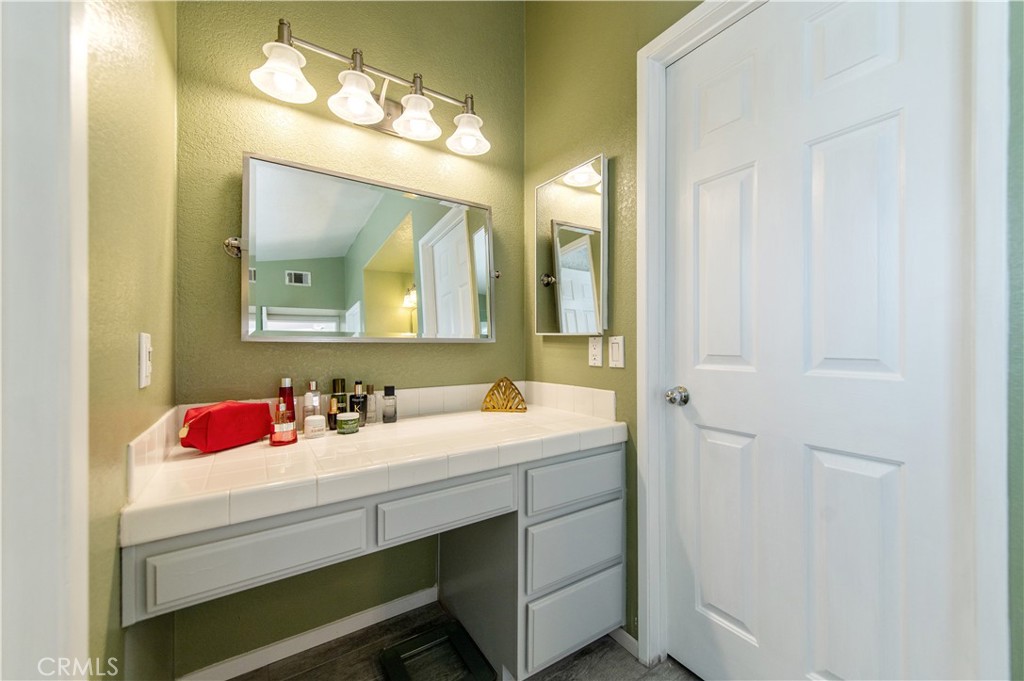 9111 Hamilton Street Rancho Cucamonga, CA 91701 - Photo 32 of 46 a bathroom with a sink and a mirror
