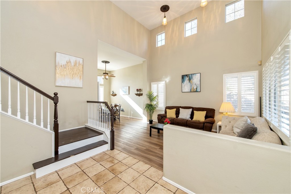 9111 Hamilton Street Rancho Cucamonga, CA 91701 - Photo 4 of 46 a living room with furniture and a table with wooden floor