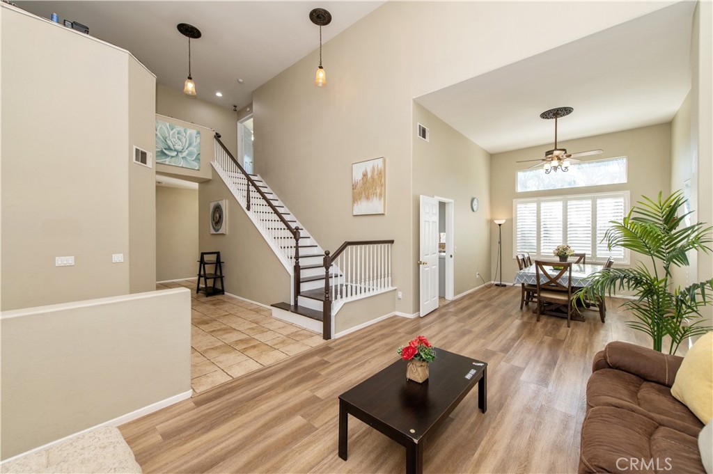 9111 Hamilton Street Rancho Cucamonga, CA 91701 - Photo 5 of 46 a living room with furniture and a wooden floor