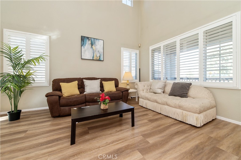 9111 Hamilton Street Rancho Cucamonga, CA 91701 - Photo 6 of 46 a living room with furniture and a large window
