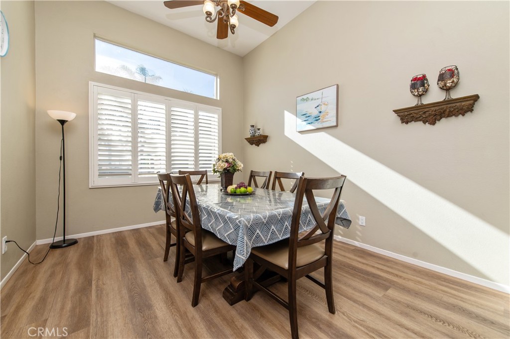 9111 Hamilton Street Rancho Cucamonga, CA 91701 - Photo 7 of 46 a view of a dining room with furniture window and wooden floor