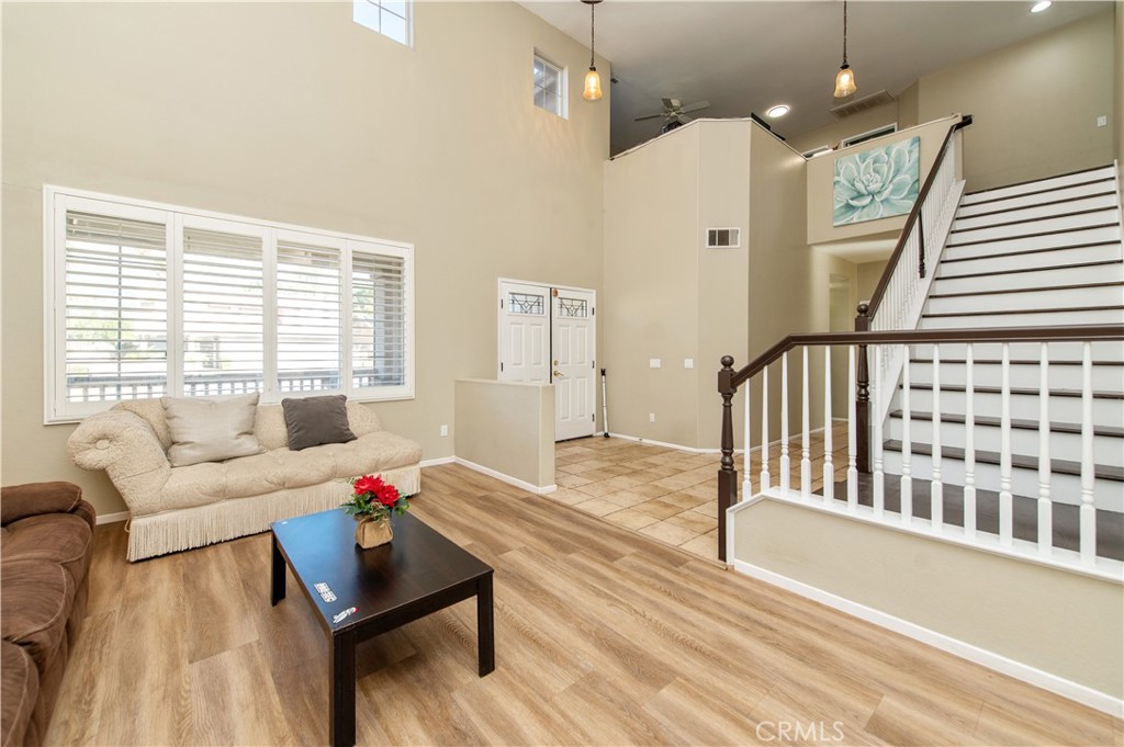 9111 Hamilton Street Rancho Cucamonga, CA 91701 - Photo 9 of 46 a living room with furniture and wooden floor