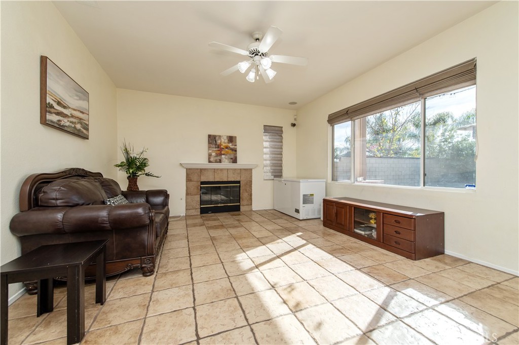 9111 Hamilton Street Rancho Cucamonga, CA 91701 - Photo 10 of 46 a living room with furniture and a fireplace