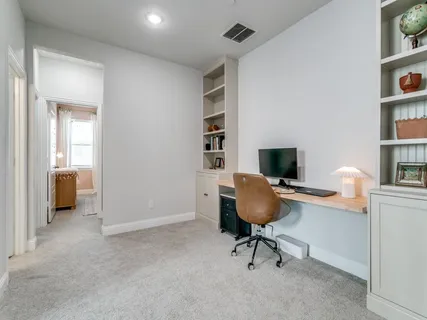 a view of a workspace with furniture