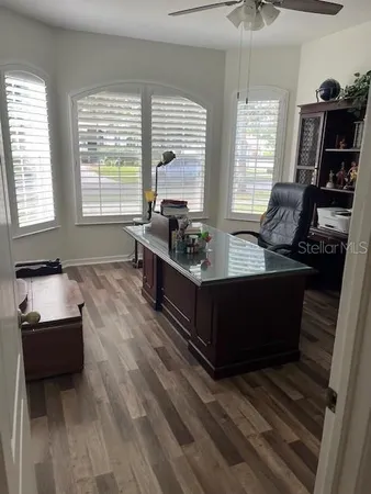 a living room with furniture and a window