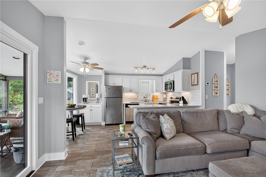 1230 Melton Road, Unit 4 West Union, SC 29696 - Photo 41 of 48 An inviting open-concept living area boasts a well-appointed kitchen and convenient access to an outdoor screened porch.