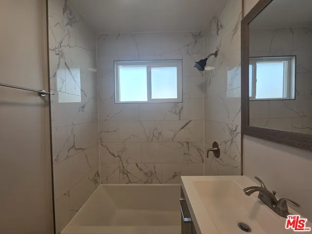 a bathroom with a sink and a bathtub