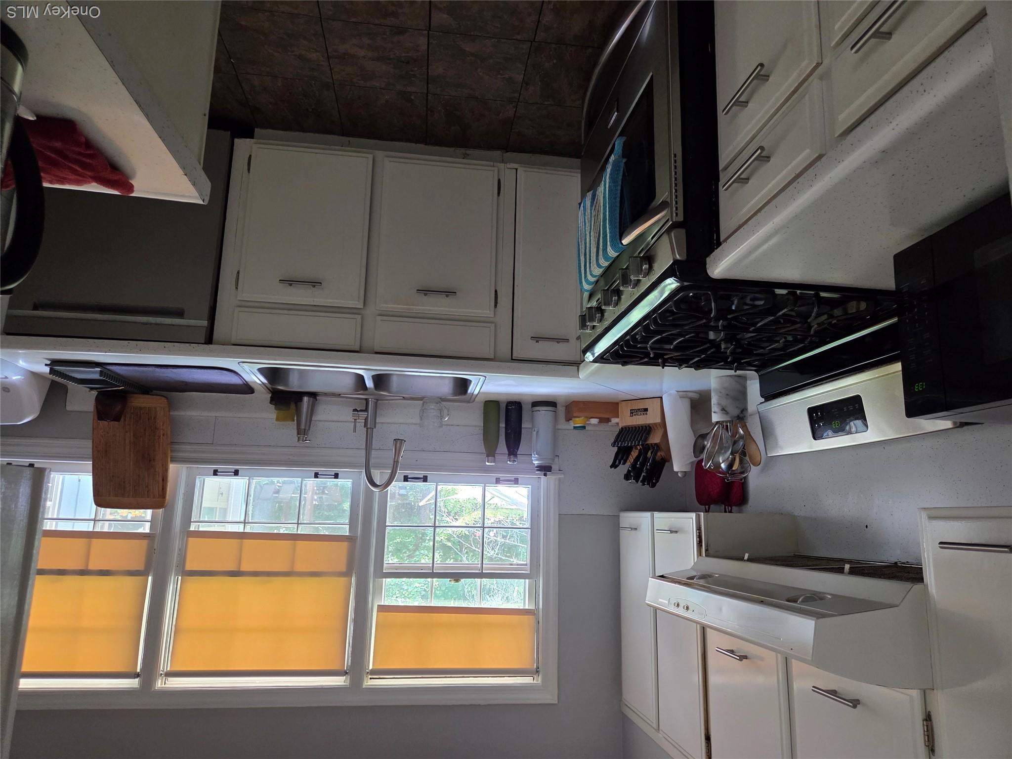 342 Coldenham Road Walden, NY 12586 - Photo 17 of 20 a kitchen with a sink stove top oven and cabinets