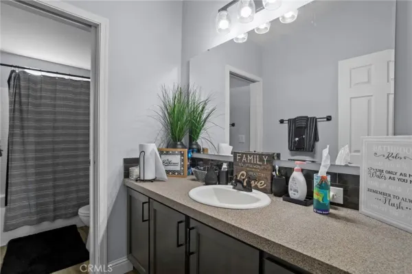 a bathroom with a double vanity sink and a mirror