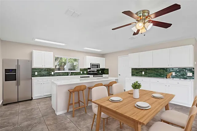 a kitchen with sink and cabinets
