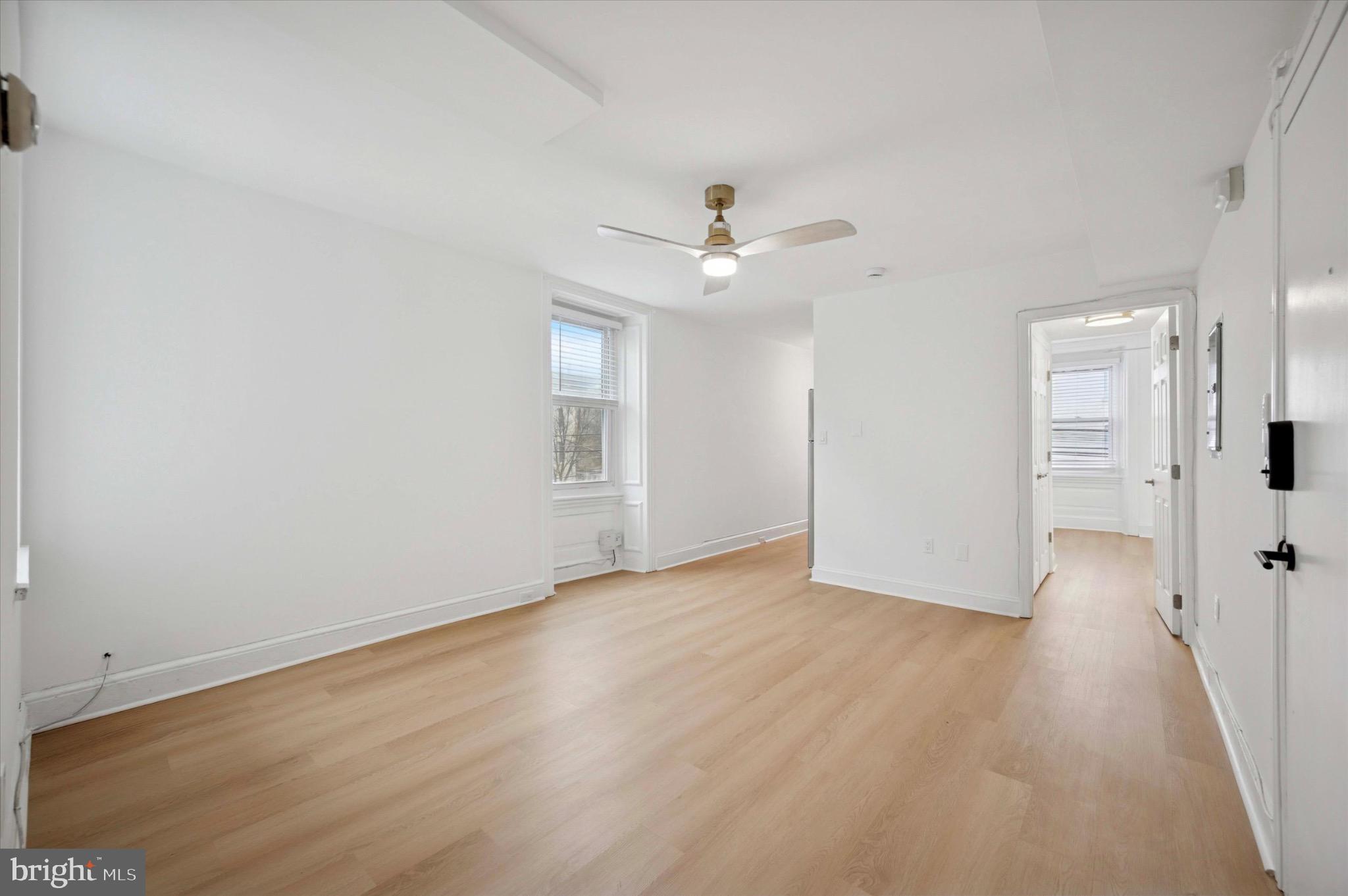 3869 Terrace Street, Unit 2 Philadelphia, PA 19128 - Photo 13 of 16 wooden floor in an empty room with a window