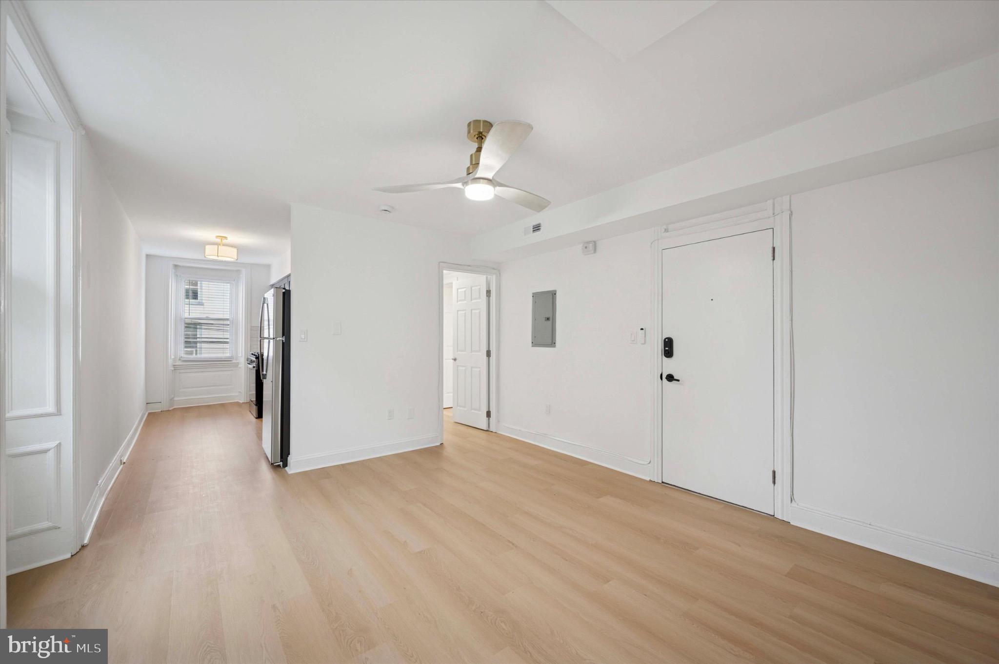 3869 Terrace Street, Unit 2 Philadelphia, PA 19128 - Photo 14 of 16 a view of a big room with wooden floor and windows