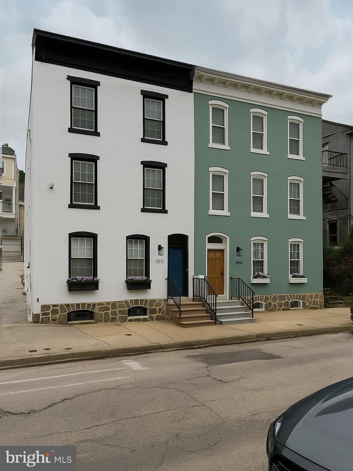 3869 Terrace Street, Unit 2 Philadelphia, PA 19128 - Photo 2 of 16 a front view of a building with lots of windows