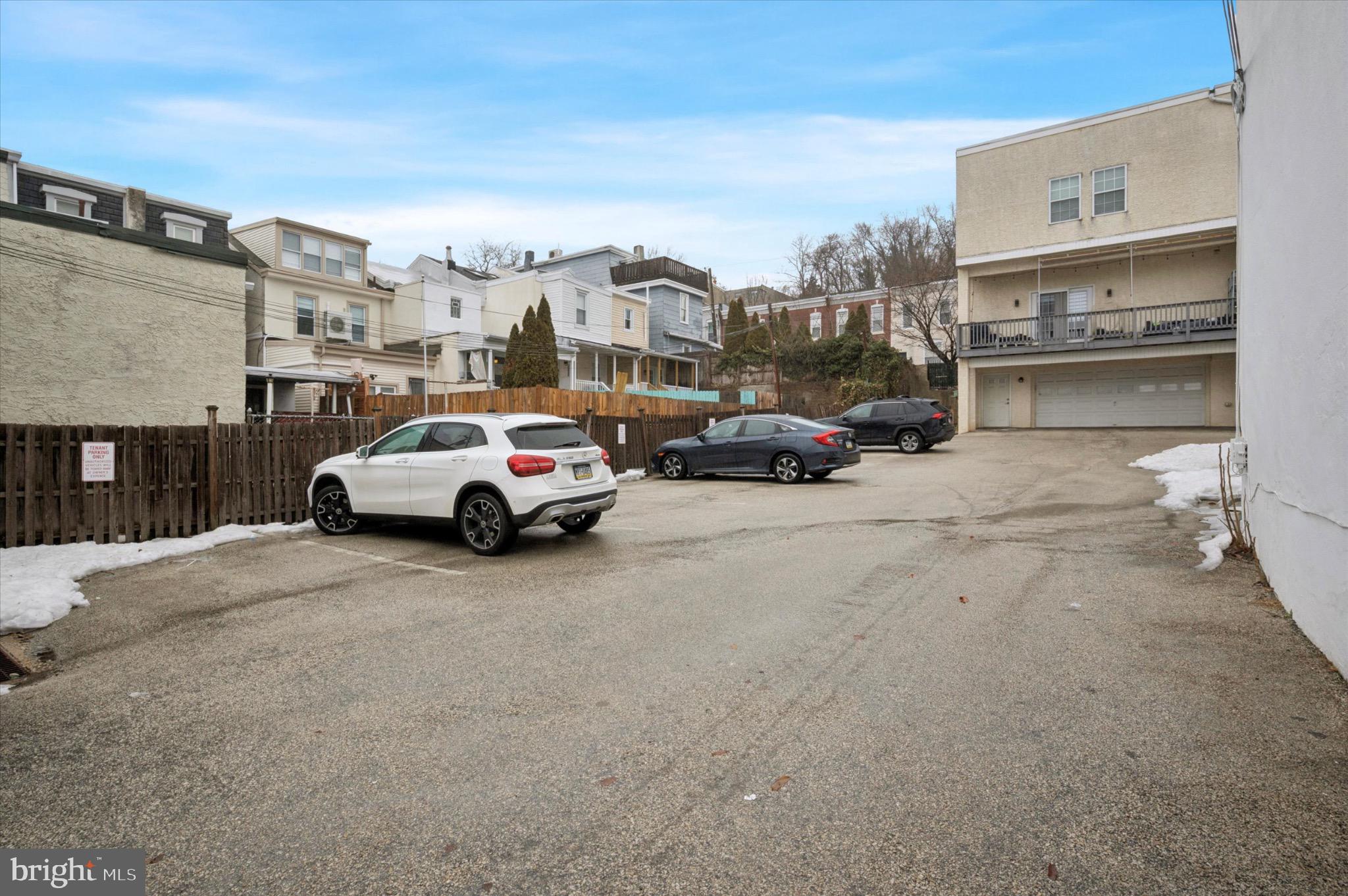 3869 Terrace Street, Unit 2 Philadelphia, PA 19128 - Photo 4 of 16 a view of cars parked in front of a building