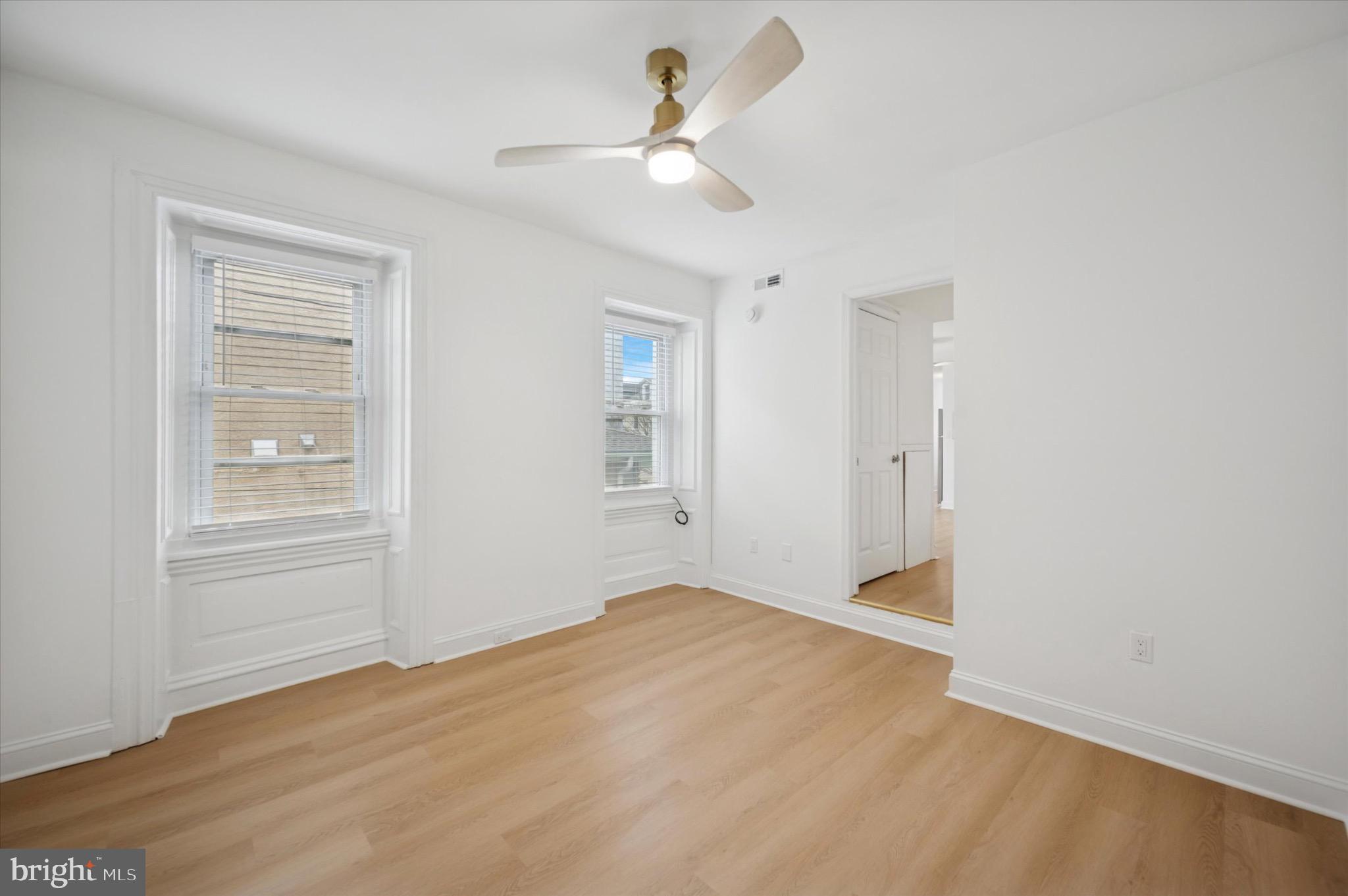 3869 Terrace Street, Unit 2 Philadelphia, PA 19128 - Photo 6 of 16 wooden floor in an empty room with a window