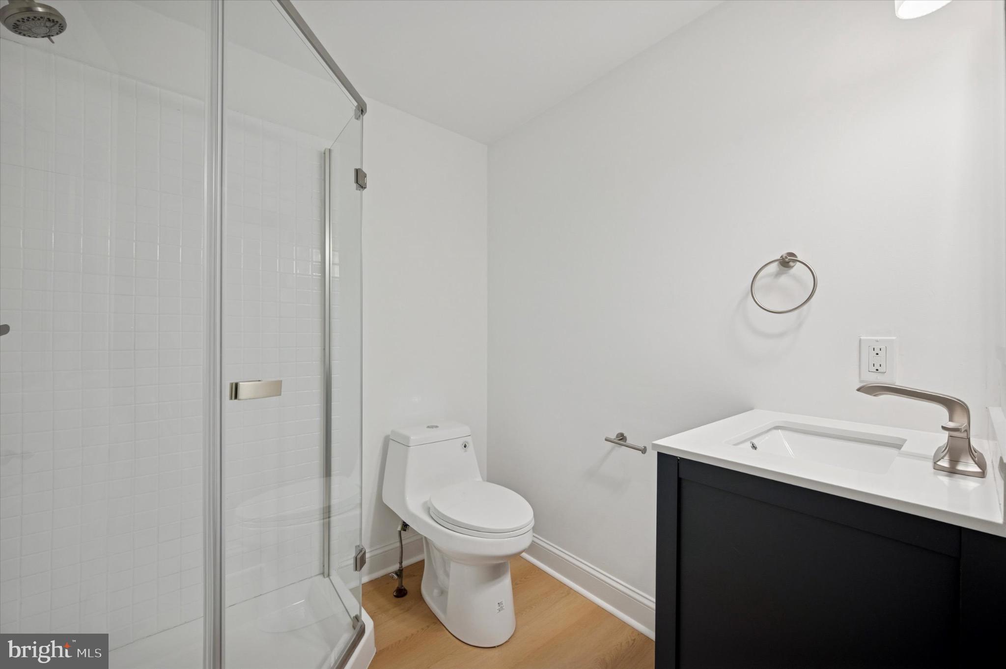 3869 Terrace Street, Unit 2 Philadelphia, PA 19128 - Photo 8 of 16 a bathroom with a toilet sink and a mirror