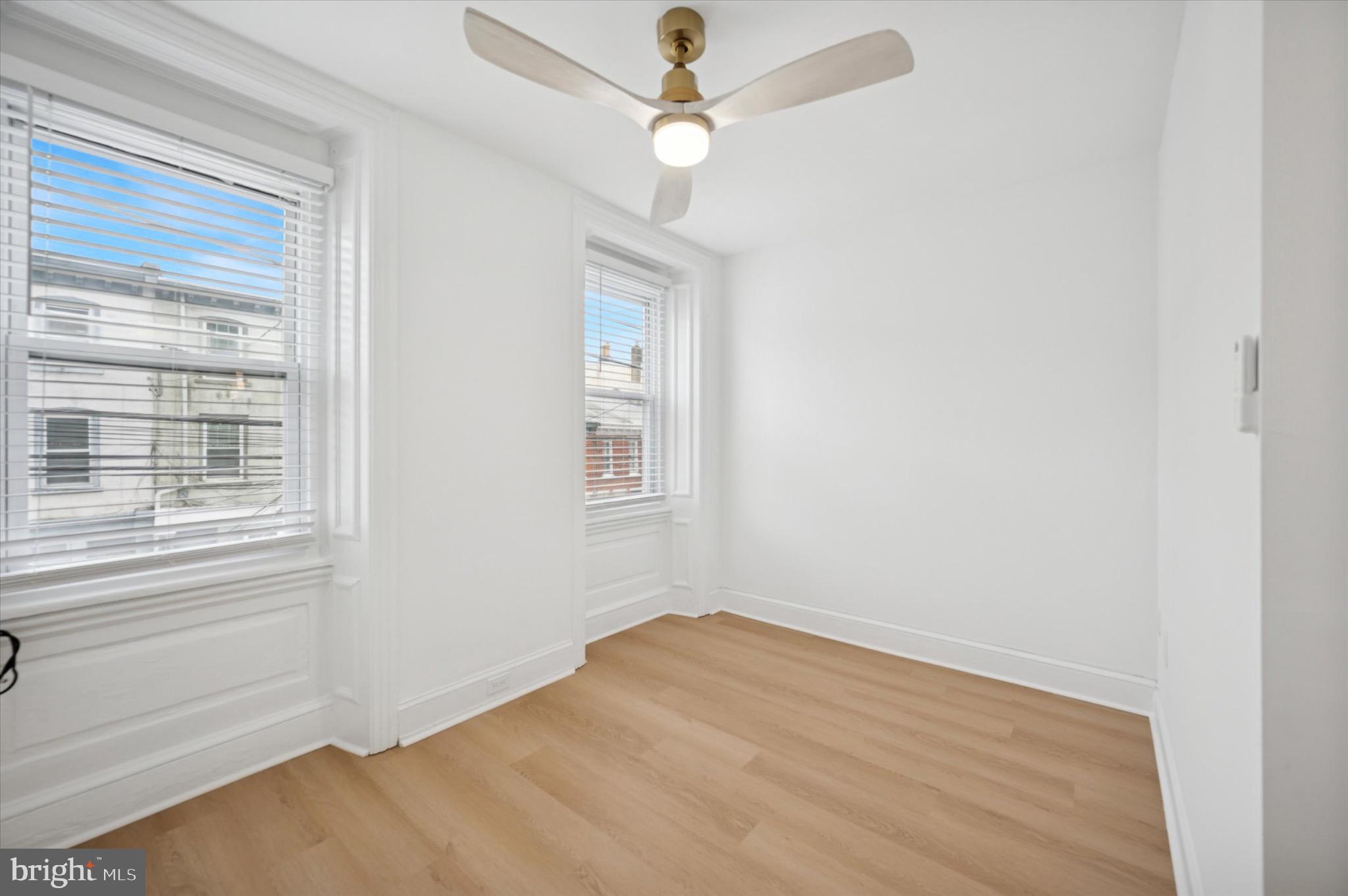 3869 Terrace Street, Unit 2 Philadelphia, PA 19128 - Photo 10 of 16 an empty room with a window and ceiling fan