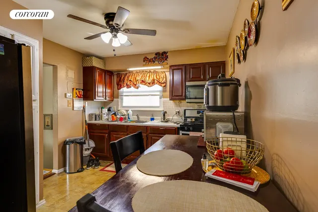 a living room with furniture a flat screen tv and a table