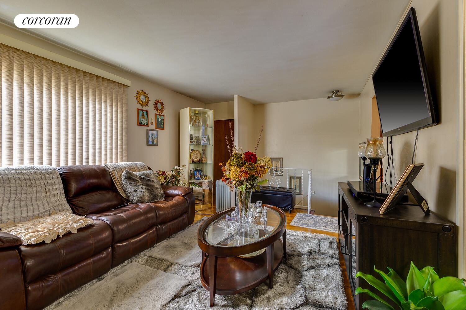 137-17 160th Street Queens, NY 11434 - Photo 4 of 14 a living room with furniture and a flat screen tv