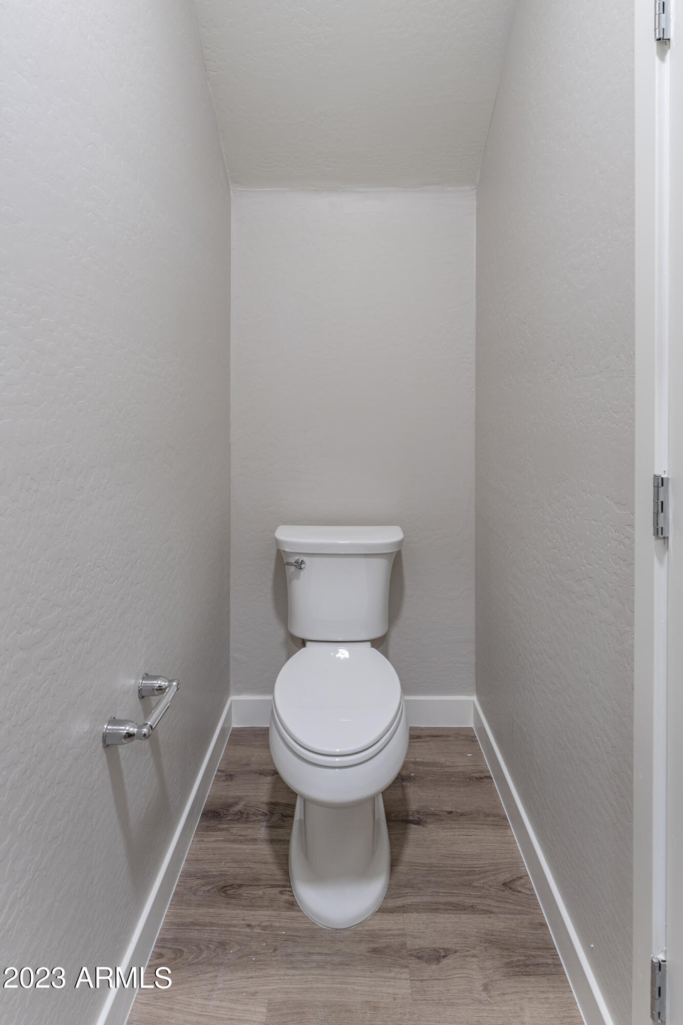 432 South 32nd Street, Unit 104 Mesa, AZ 85204 - Photo 21 of 75 a white toilet sitting in a bathroom
