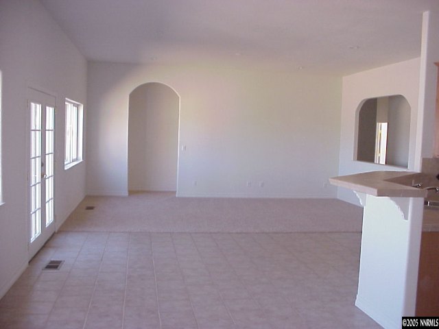 2195 Argonaught Way Reno, NV 89506 - Photo 4 of 7 a view of a livingroom with wooden floor and a large window