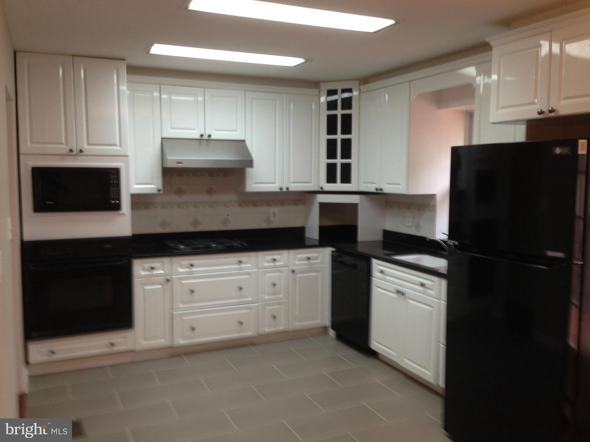 9501 Juliette Drive Clinton, MD 20735 - Photo 2 of 27 a kitchen with a refrigerator stove and sink