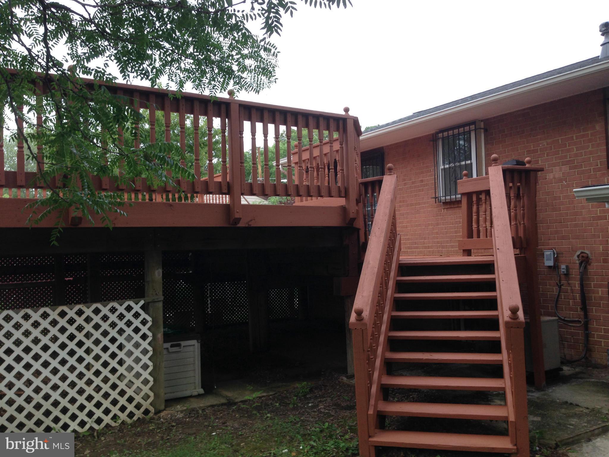 9501 Juliette Drive Clinton, MD 20735 - Photo 26 of 27 a front view of a house with a garden