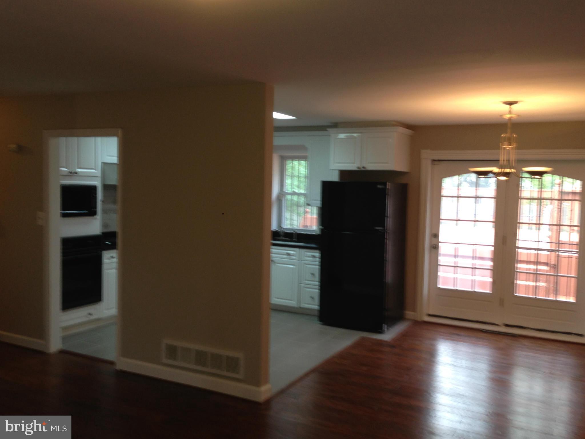 9501 Juliette Drive Clinton, MD 20735 - Photo 7 of 27 an empty room with wooden floor and windows