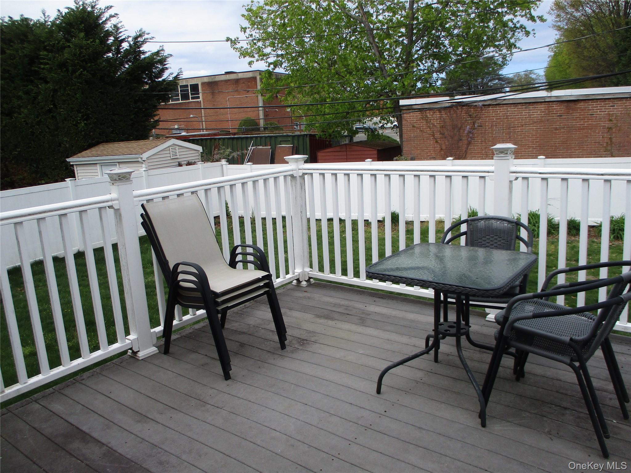 19 Acorn Road East Rockaway, NY 11518 - Photo 15 of 16 a view of a chair and table on the deck
