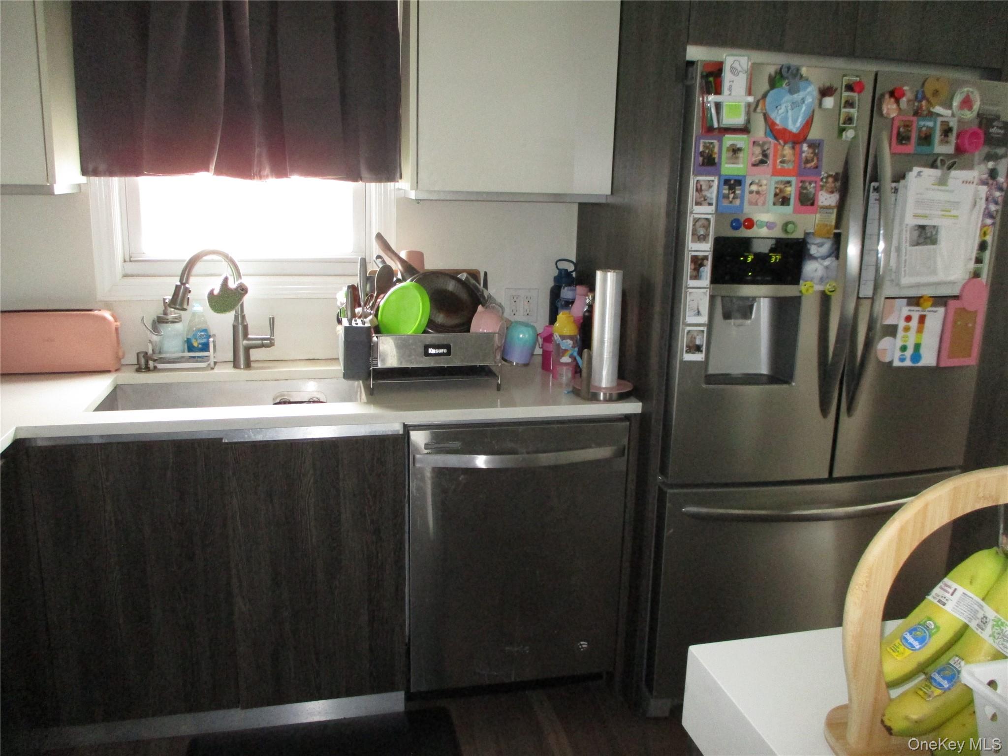 19 Acorn Road East Rockaway, NY 11518 - Photo 3 of 16 a kitchen with stainless steel appliances granite countertop a refrigerator and a sink