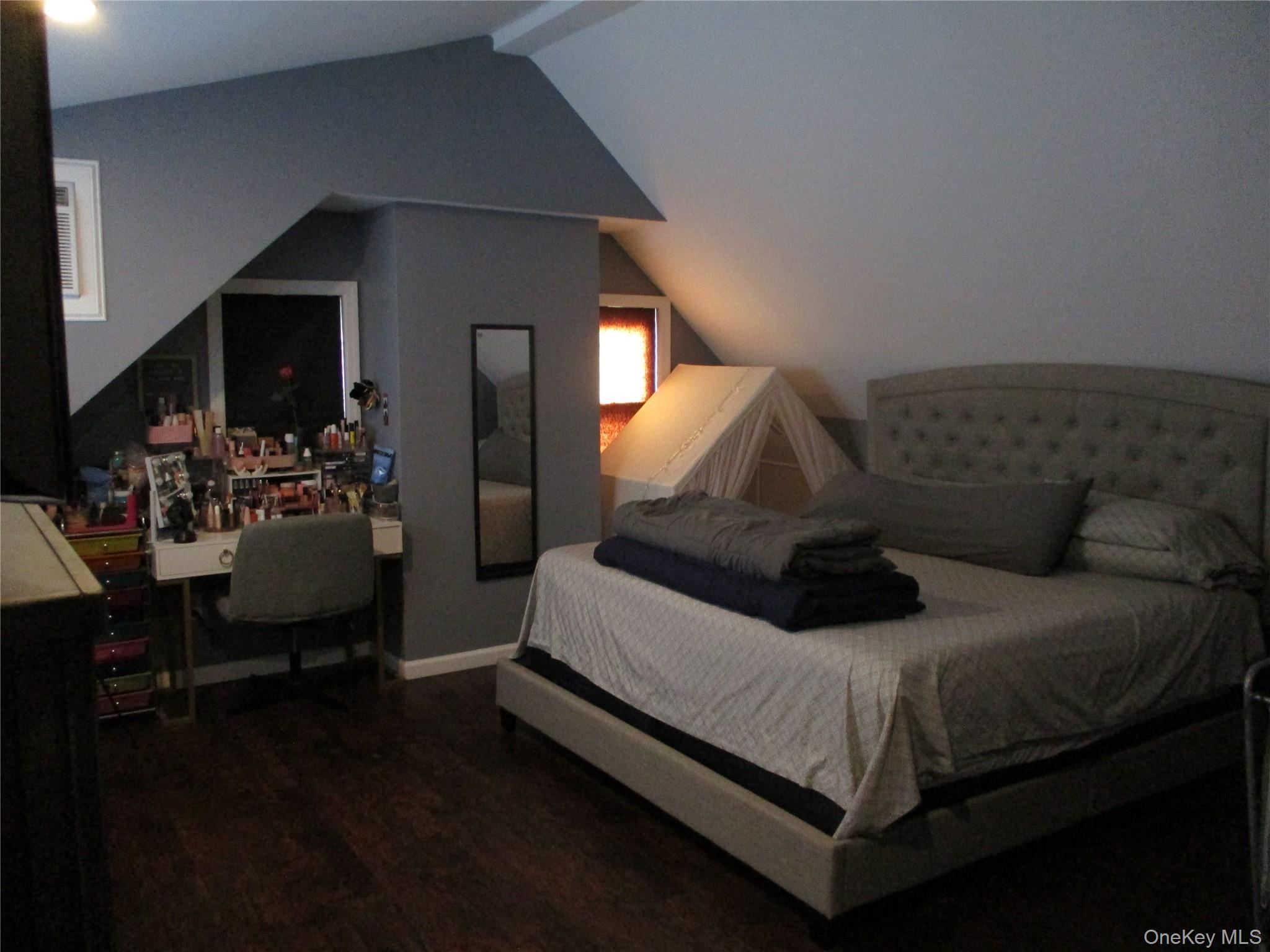 19 Acorn Road East Rockaway, NY 11518 - Photo 6 of 16 a bed room with a bed window and a couch