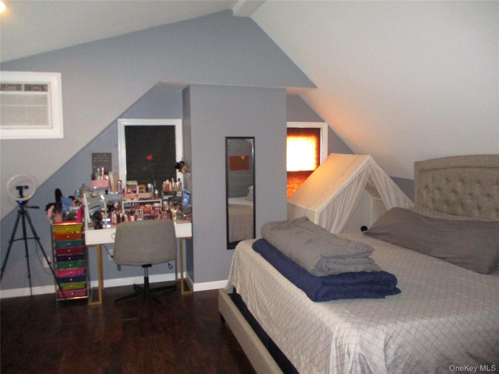 19 Acorn Road East Rockaway, NY 11518 - Photo 9 of 16 a bedroom with furniture and a wooden floor