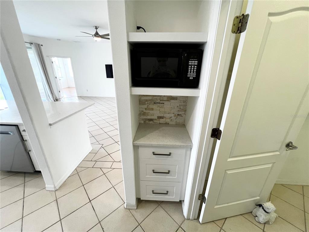 7463 Ridge Road Sarasota, FL 34238 - Photo 16 of 30 a bathroom with a sink and a mirror