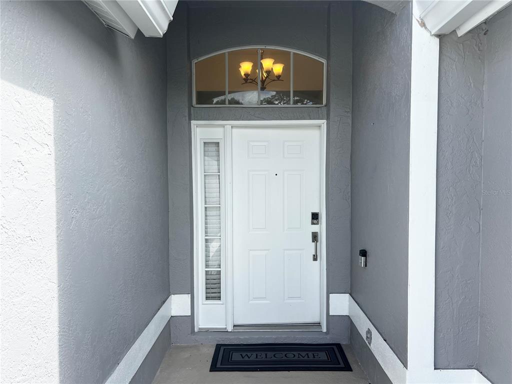 7463 Ridge Road Sarasota, FL 34238 - Photo 2 of 30 a view of a hallway view with wooden floor and staircase