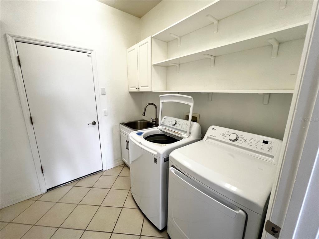7463 Ridge Road Sarasota, FL 34238 - Photo 23 of 30 a utility room with dryer and washer