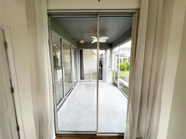 a view of a room with porch and wooden floor