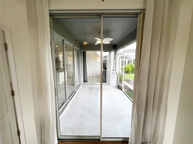 a view of a room with porch and wooden floor
