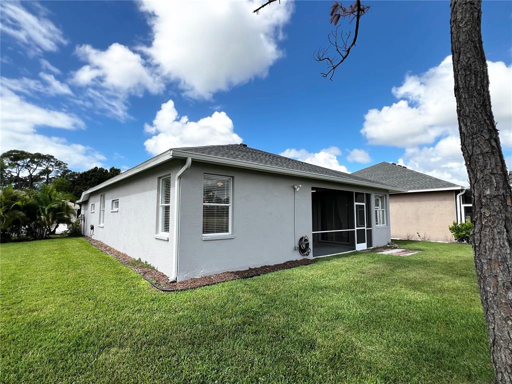 7463 Ridge Road Sarasota, FL 34238 - Photo 27 of 30 a front view of a house with garden