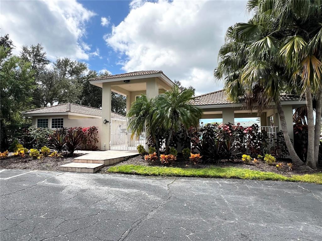 7463 Ridge Road Sarasota, FL 34238 - Photo 29 of 30 a front view of house with yard and green space