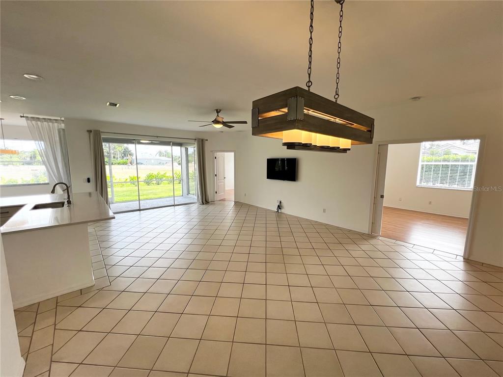 7463 Ridge Road Sarasota, FL 34238 - Photo 6 of 30 a view of a kitchen with a sink and an empty room